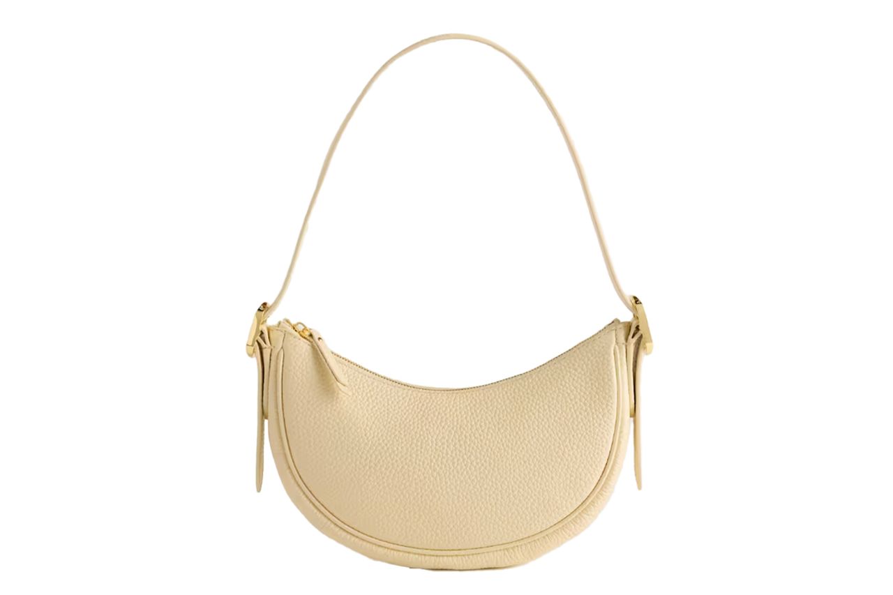 Curved leather shoulder bag with a single strap Credit: Quince