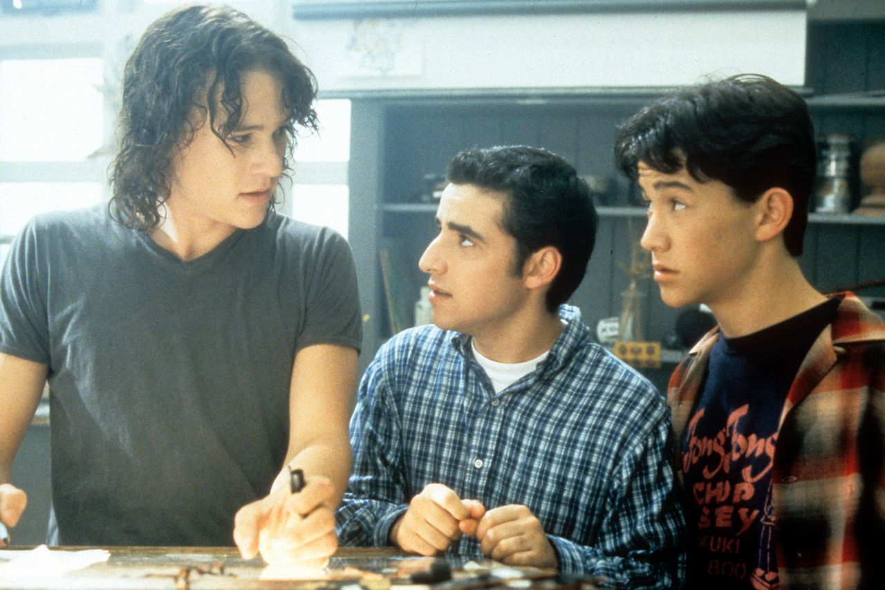 Heath Ledger, David Krumholtz, and Joseph Gordon-Levitt standing at table in a scene from the film ‘10 Things I Hate About You’, 1999.Credit: Buena Vista/Getty