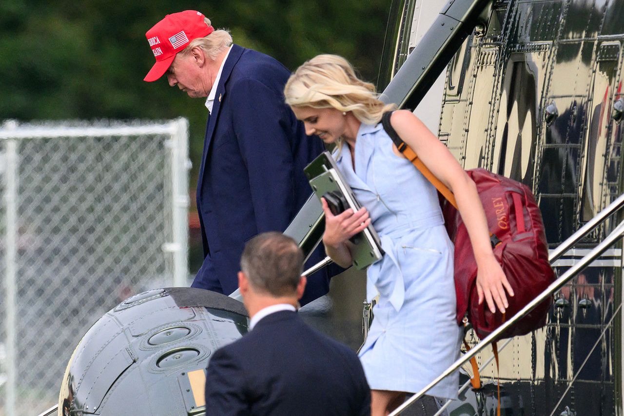 President Donald Trump and aide Natalie Harp exit Marine One near the White House on Aug. 16.Credit: Mandel NGAN / AFP via Getty