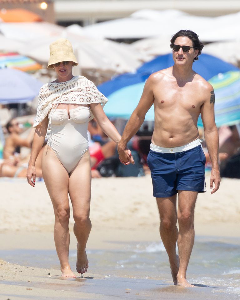 Katy Perry and Justin Trudeau hold hands at Les Palmiers beach club in Saint-Tropez on July 30.Credit: BACKGRID