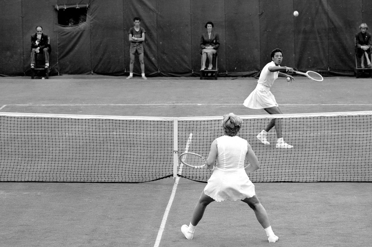 Althea Gibson waits intently under a return by Darlene Hard during the first set of their match at Fores Hills.Credit: Charles Payne/NY Daily News Archive via Getty