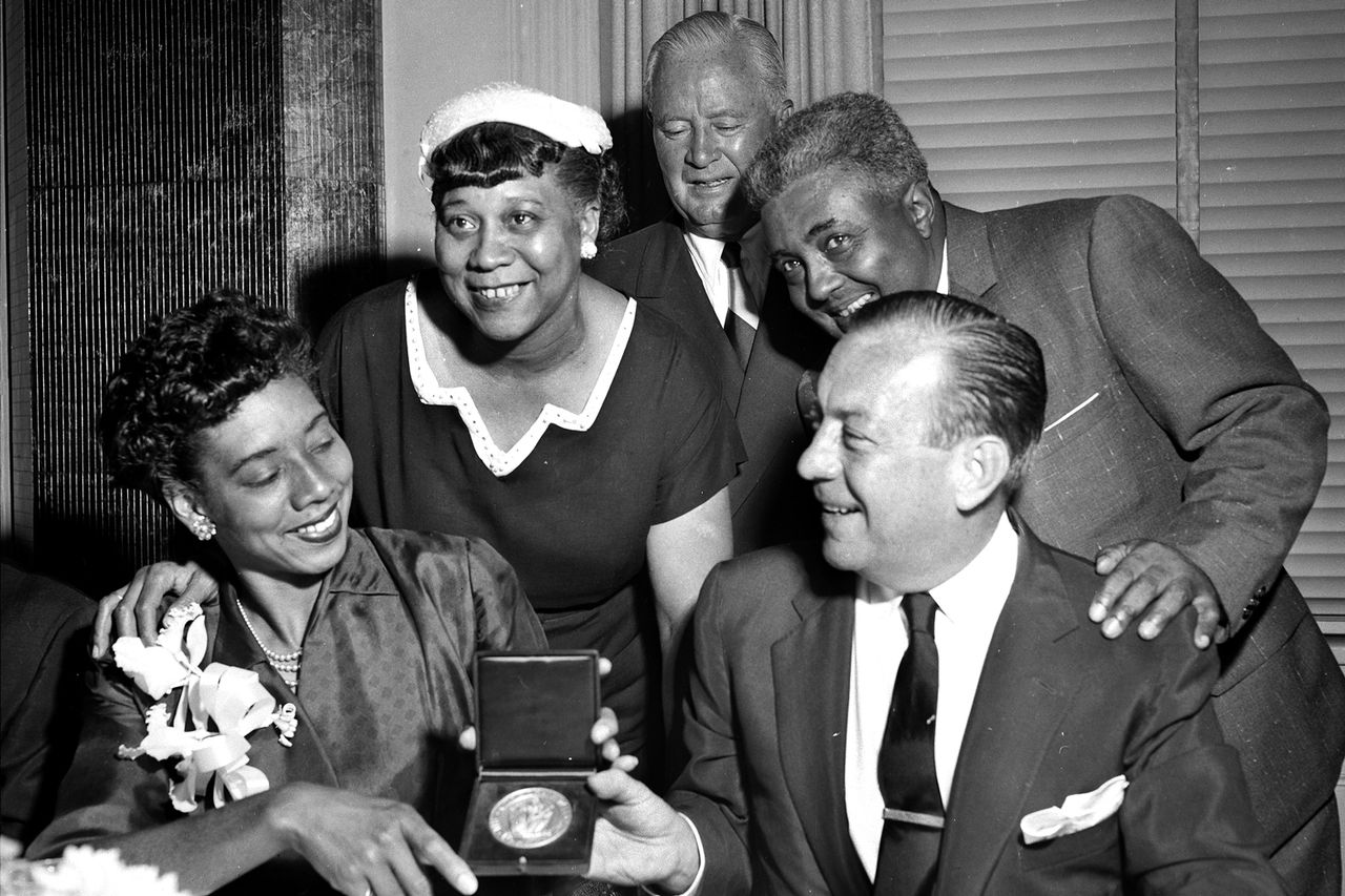 Althea Gibson gets medal from Mayor Wagner with her parents.Credit: Phil Greitzer/NY Daily News Archive via Getty
