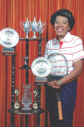 Althea Gibson poses for a portrait at her home surrounded by her trophies on June 12, 1987 in East Orange, NJ.Credit: Yvonne Hemsey/Getty