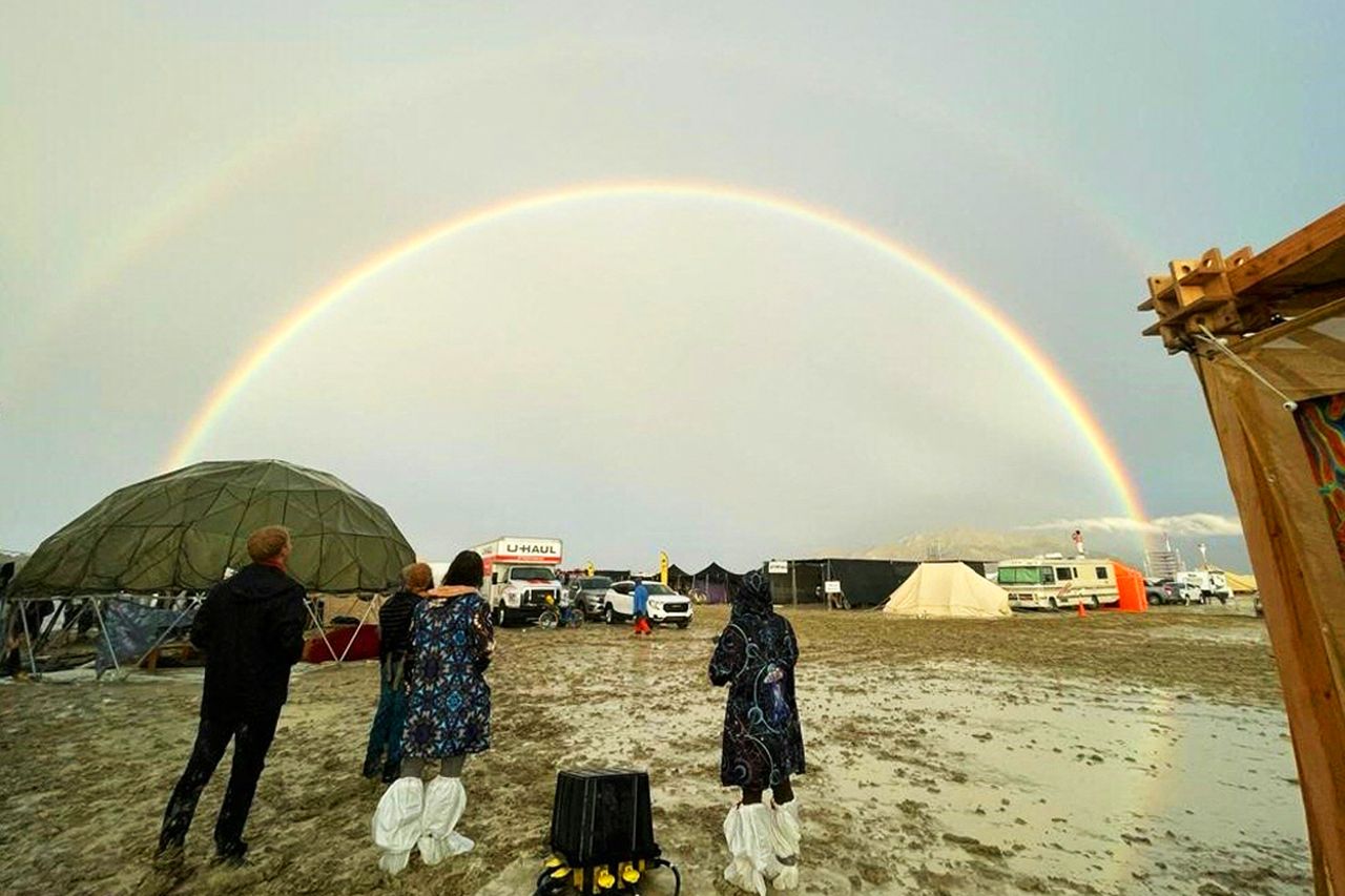 Attendees look at a double rainbow during the 2023 Burning Man festival. Attendees look at a double rainbow during the 2023 Burning Man festival.Credit: JULIE JAMMOT/AFP via Getty