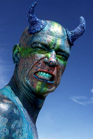 Mark Day is painted with blue food coloring during the Burning Man Festival. Mark Day is painted with blue food coloring during the Burning Man Festival.Credit: Rick Loomis/Los Angeles Times via Getty