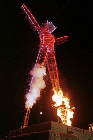 Stuntman Ted Batchblor sets himself on fire as he ignites the neon-lit Burning Man statue during the Burning Man Festival. Stuntman Ted Batchblor sets himself on fire as he ignites the neon-lit Burning Man statue during the Burning Man Festival.Credit: MIKE NELSON/AFP via Getty