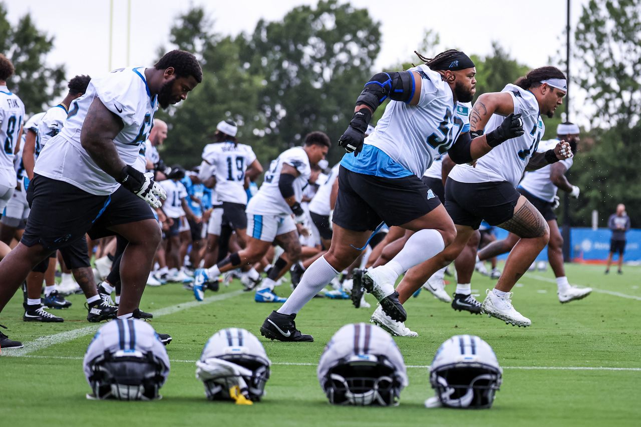 Robert Hunt #50 of the Carolina Panthers warms up during the Carolina Panthers Training Camp at Carolina Panthers Practice Fields on July 23, 2026 in Charlotte, North Carolina Carolina Panthers players warm up during training camp in Charlotte, N.C., on July 23, 2026Credit: David Jensen/Getty