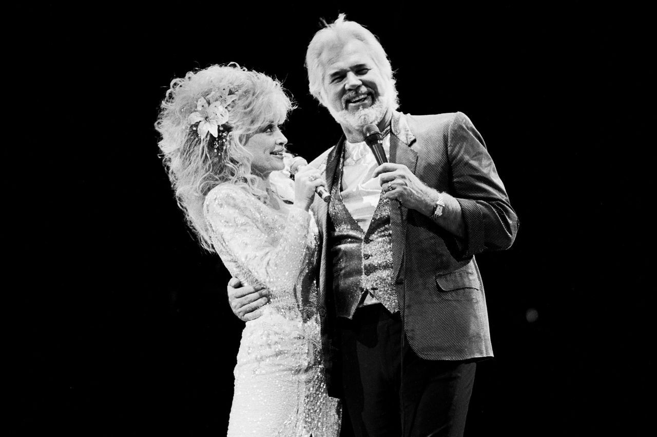 Dolly Parton and Kenny Rogers perform together on Oct. 20, 1988, in East Rutherford, N.J.Credit: Gary Gershoff/Getty