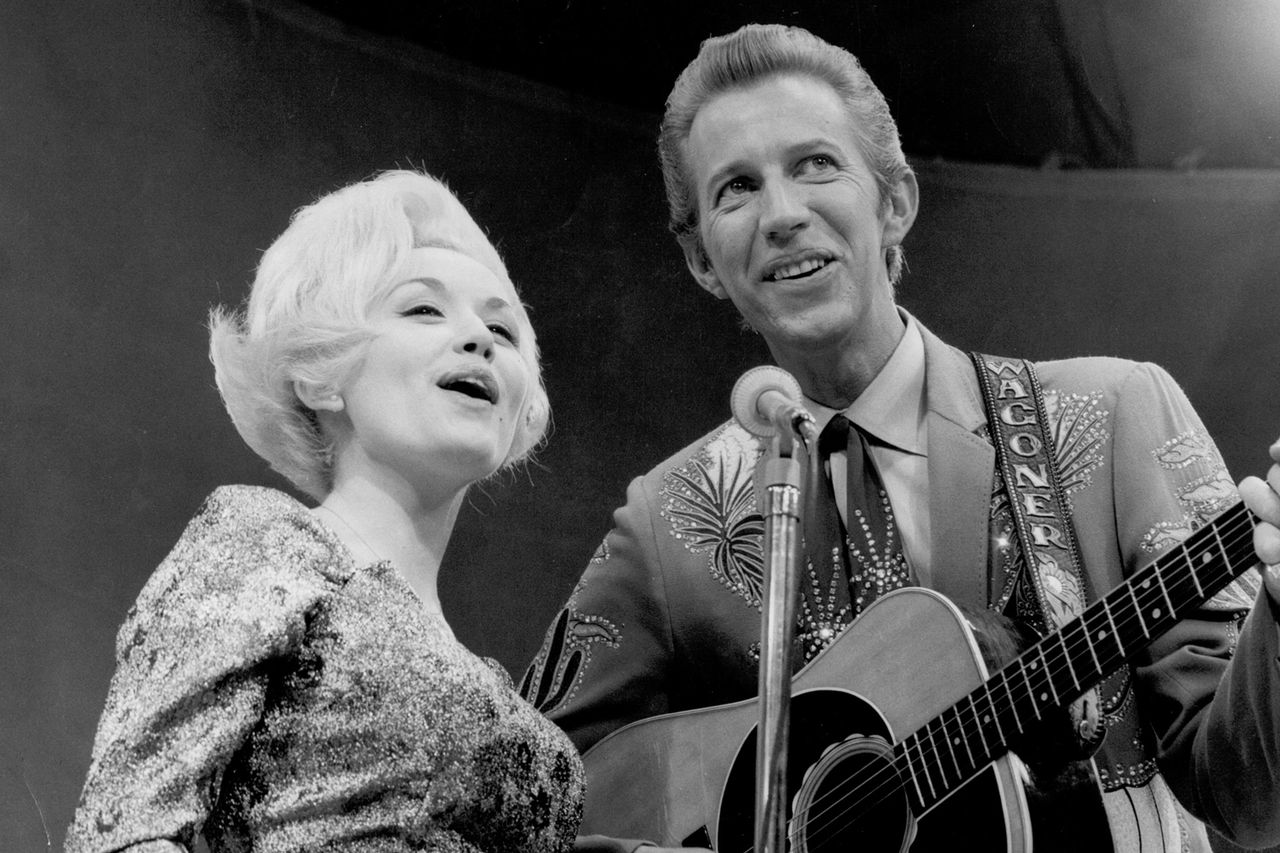 Dolly Parton and Porter Wagoner perform onstage in 1967Credit: Michael Ochs Archives/Getty