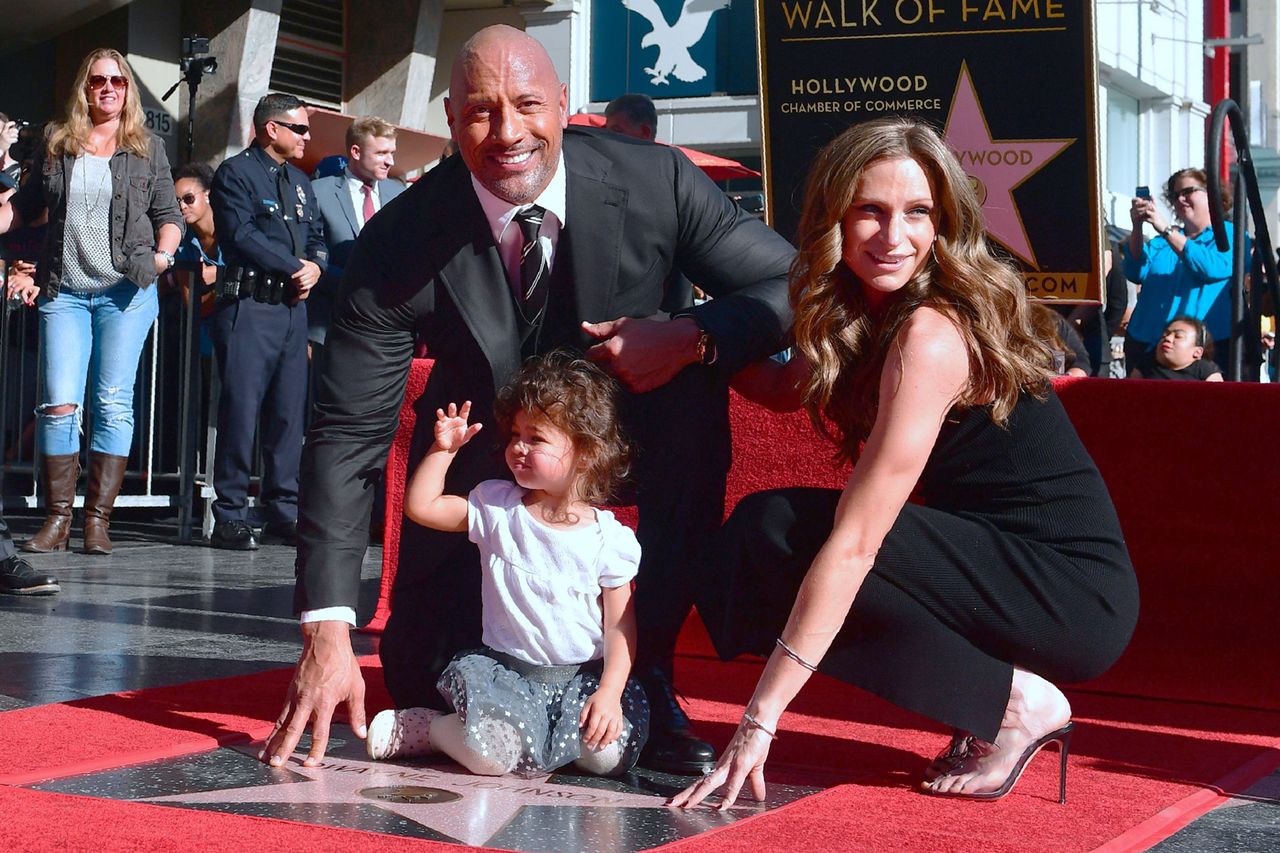 Dwayne Johnson and his wife Lauren Hashian and daughter pose on his Hollywood Walk of Fame Star is unveiled on Dec. 13, 2017Credit: FREDERIC J. BROWN/AFP via Getty
