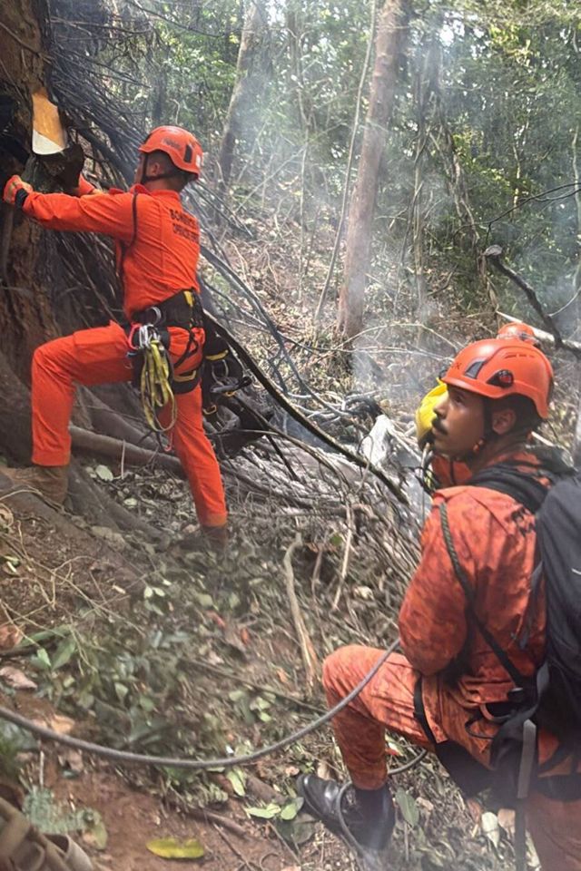 A Robinson R44 helicopter crashes in a forested area near Vista Chinesa in Rio de Janeiro, Brazil, on August 08, Firefighters work on wreckage of a helicopter in Rio de Janeiro, Brazil, on Aug. 8, 2026Credit: CBMERJ Press Office / Handout/Anadolu via Getty