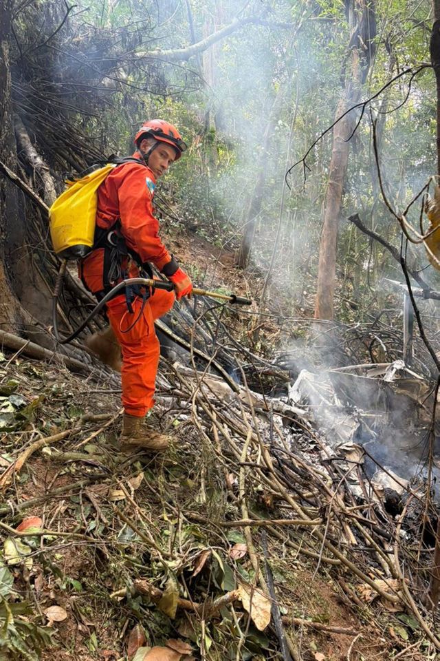 A Robinson R44 helicopter crashes in a forested area near Vista Chinesa in Rio de Janeiro, Brazil, on August 08, Firefighters work on wreckage of a helicopter in Rio de Janeiro, Brazil, on Aug. 8, 2026Credit: CBMERJ Press Office / Handout/Anadolu via Getty