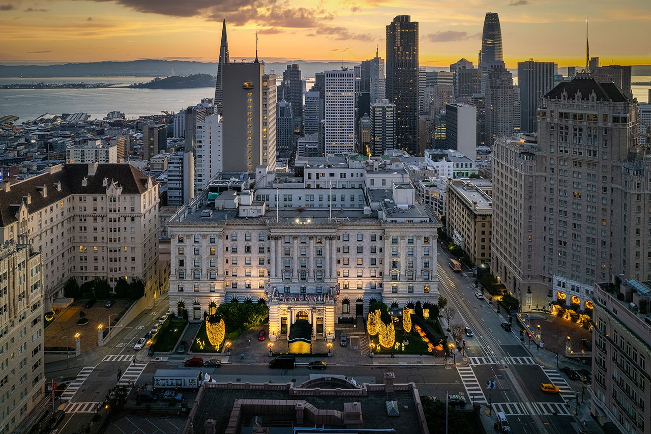 Aerial view of icon Hotels at Nob Hill. Famous Fairmont Hotel and the Mark Hopkins in the early morning hours with holiday lights. The San Francisco skylineCredit: Getty