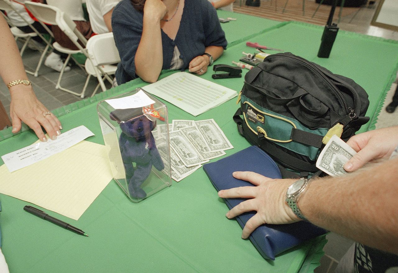 A successful bidder pays $200 for a Princess Beanie Baby at a mall in Cerritos, Calif., on July 23, 1998Credit: AP Photo/John Hayes