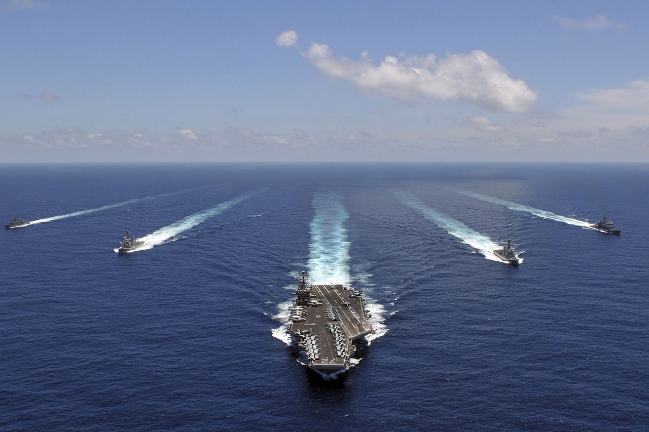 The ‘USS Abraham Lincoln’ leading a formation of ships from the Abraham Lincoln Strike GroupCredit: Getty