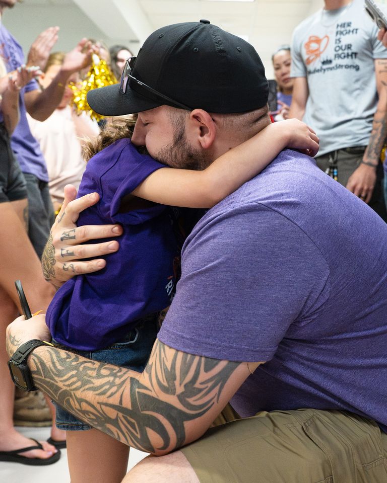 Adelynn Taylor hugging her dad.Credit: BDK Photography