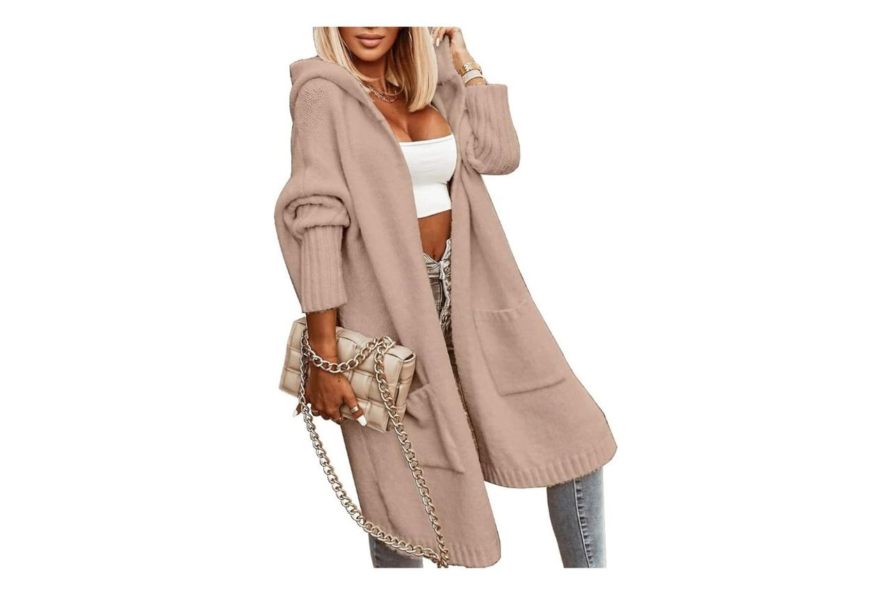 A person modeling a hooded openfront long cardigan paired with casual wear and holding a chainstrap purse Credit: Amazon
