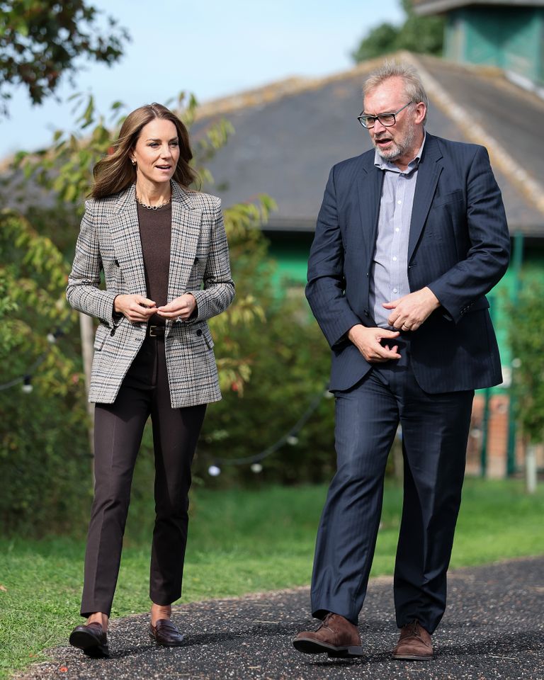 Two individuals walking outdoors along a path engaged in conversation with greenery and a building in the background Kate Middleton during a visit to The Forward Trust to mark Addiction Awareness Week on September 24, 2026 in Southend, EnglandCredit: Chris Jackson/Getty