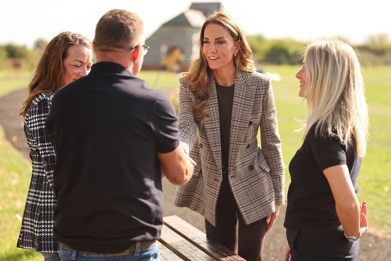 A woman with long hair shakes hands with a man with other people nearby in an outdoor setting Kate Middleton during a visit to The Forward Trust to mark Addiction Awareness Week on September 24, 2026 in Southend, EnglandCredit: Chris Jackson/Getty