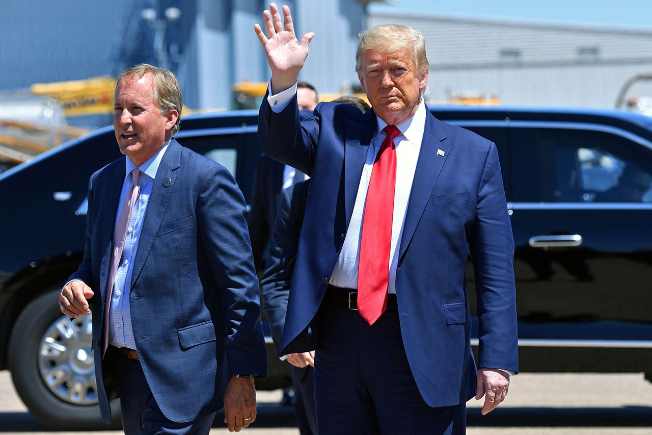 President Donald Trump with Texas attorney general Ken Paxton in Dallas on June 11, 2020.Credit: NICHOLAS KAMM/AFP via Getty