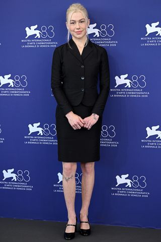 Phoebe Bridgers attends the “Primetime” Photocall in Gucci suit with visible leg hairCredit: Kate Green/Getty