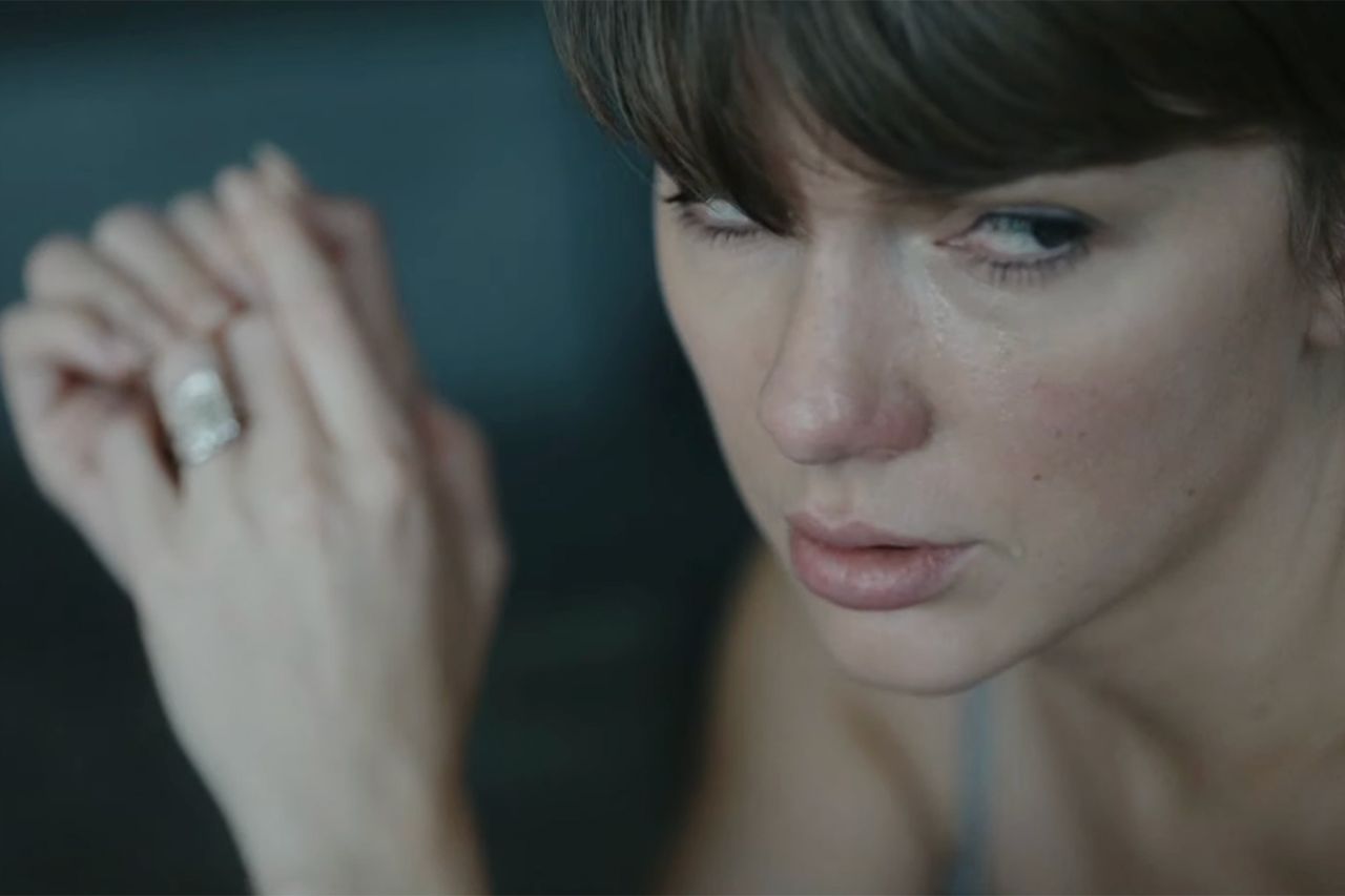 Taylor Swift appearing contemplative with her hands near her face Taylor Swift in the “Patient Zero” music videoCredit: CBS