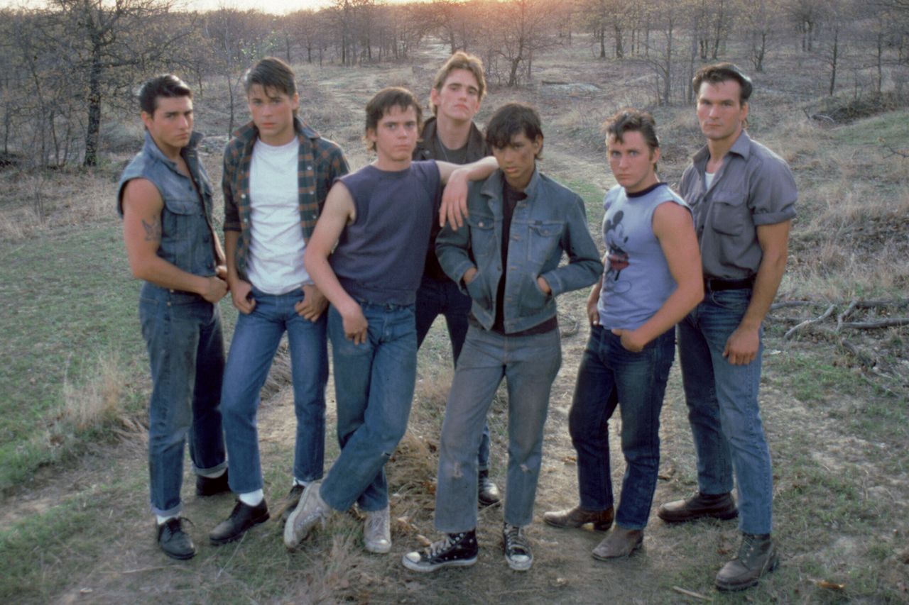 (Left-right:) Tom Cruise, Rob Lowe, Thomas C. Howell, Matt Dillon, Ralph Macchio, Emilio Estevez and Patrick Swayze on the set of ‘The Outsiders’Credit: Sunset Boulevard/Corbis/Getty