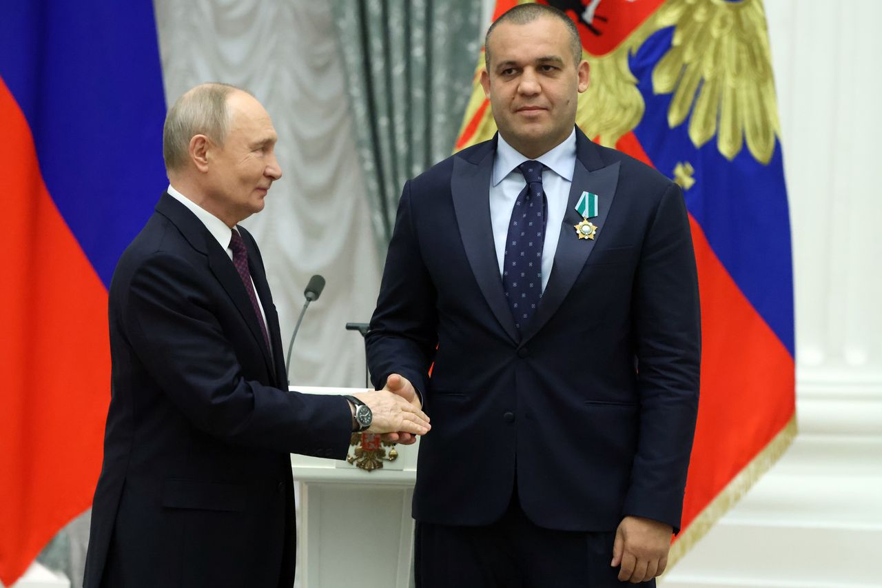 Russian President Vladimir Putin greets Umar Kremlev, the president of the International Boxing Association, on April 22 in Moscow.Credit: Contributor/Getty