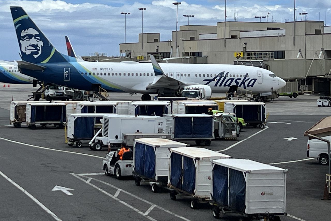 Alaska Airlines plane on the tarmac at Daniel K. Inouye International Airport in HonoluluCredit: Smith Collection/Gado/Getty