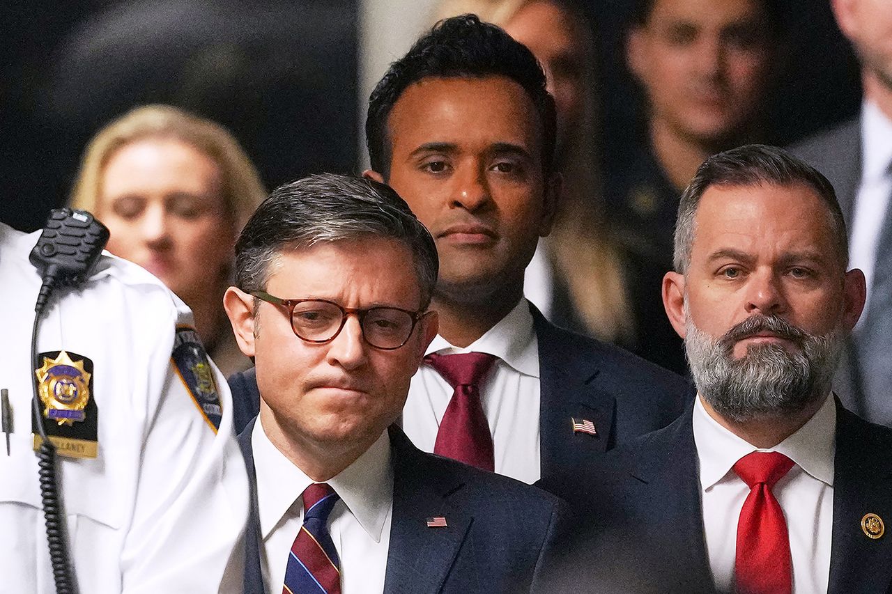 US Speaker of the House Mike Johnson (C), former presidential candidate Vivek Ramaswamy and Republican US Representative Cory Mills (R) listen as former President Donald Trump speaks to reporters on arrival to attend his trial for allegedly covering up hush money payments linked to extramarital affairs, at Manhattan Criminal Court in New York City, on May 14, 2024. House Speaker Mike Johnson and Florida Rep. Cory Mills at a New York City courthouse during the criminal trial of President Donald Trump on May 14, 2024.Credit: MICHAEL M. SANTIAGO/POOL/AFP via Getty