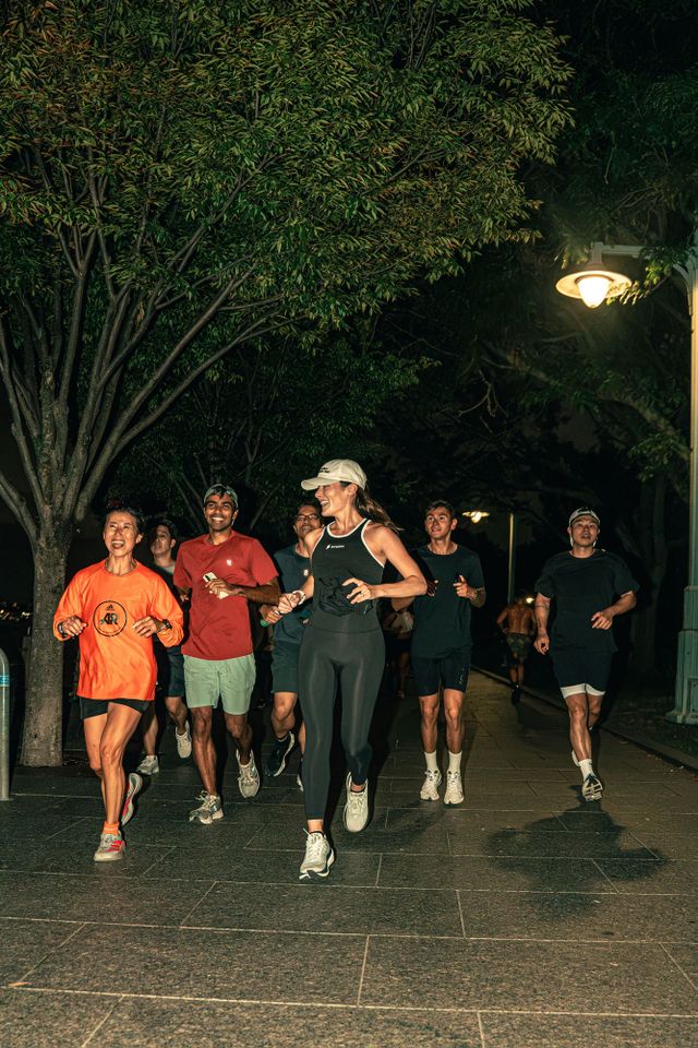 Kate Mackz and her running community.Credit: Michael Roggenbaum, Stōkt Studios