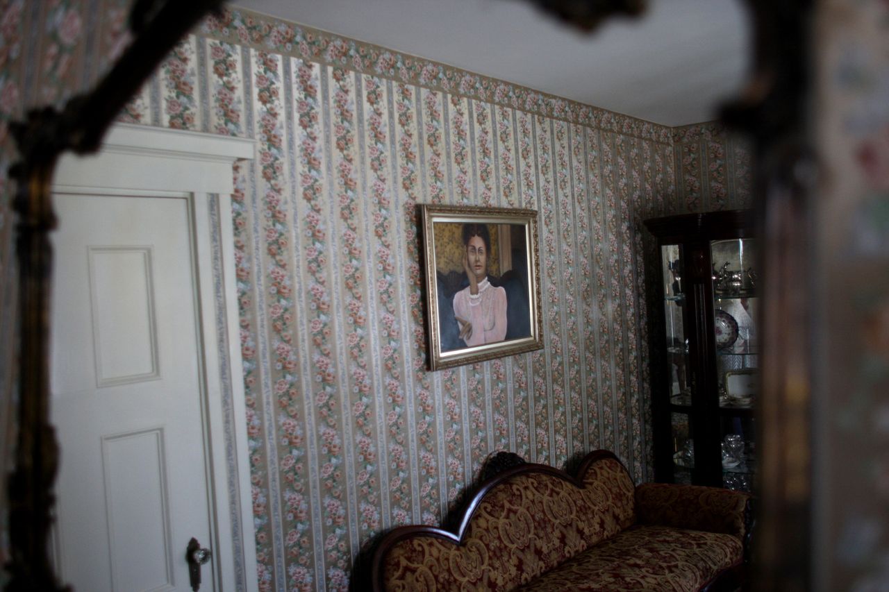 A portrait of Lizzie Borden hangs on a wall at the Lizzie Borden house.Credit: Jonathan Wiggs/The Boston Globe via Getty