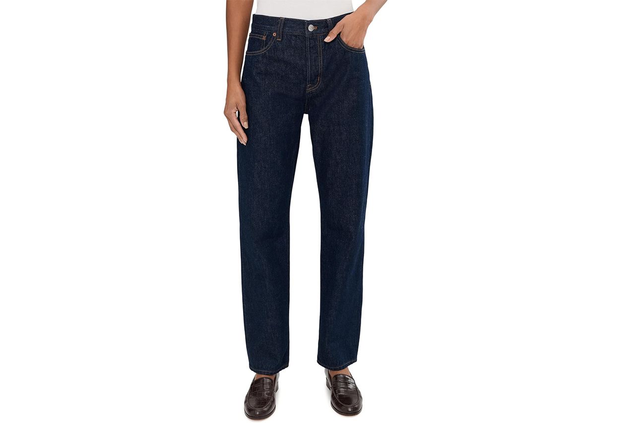 Person wearing longline straight dark denim jeans and leather shoes Credit: Amazon