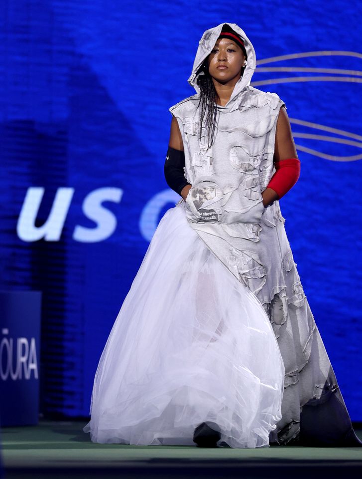Naomi Osaka standing wearing a unique outfit at an event Naomi Osaka at the U.S. Open on Aug. 31, styled by Law Roach.Credit: Mike Stobe/Getty