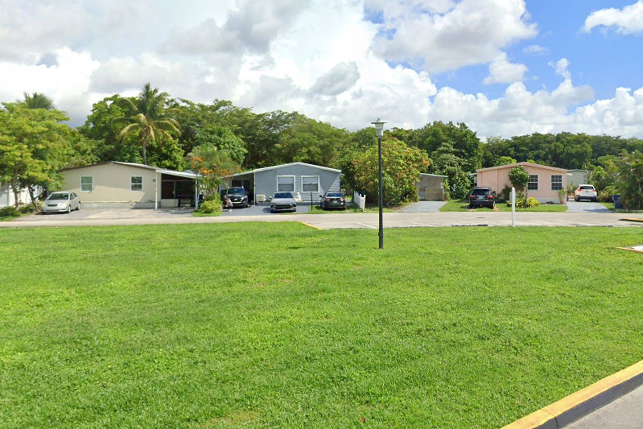 The Royal Country Mobile Homes neighborhood in Opa-locka, Florida, where Yirsi Esperanza Machado Rivera allegedly threw a bucket containing human feces at a neighbor she accused of having a sexual relationship with her husband. The Royal Country Mobile Homes in MiamiCredit: Google