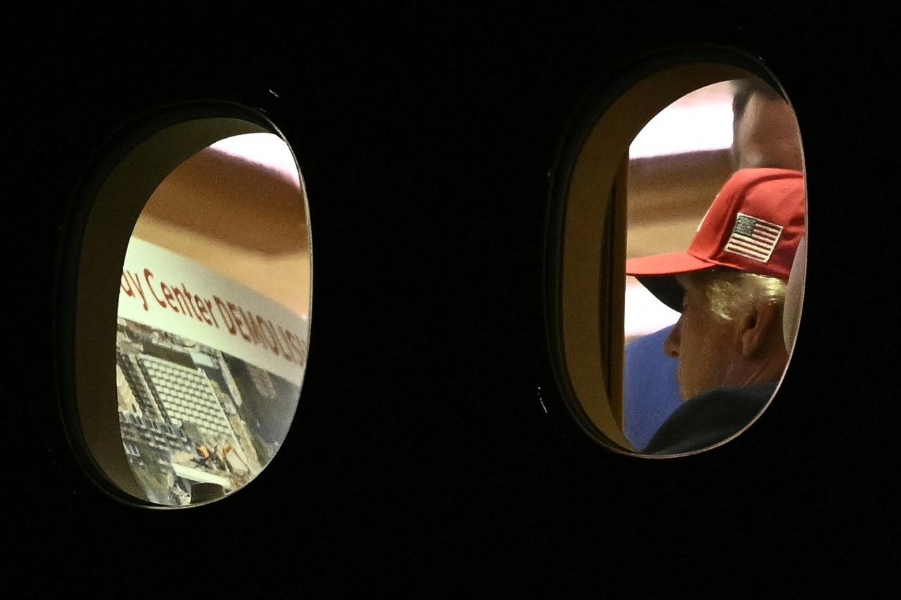 President Donald Trump is seen aboard Air Force One examining a Kennedy Center large printout after landing at Joint Base Andrews in Maryland on Sept. 16.Credit: Brendan Smialowski/AFP/Getty