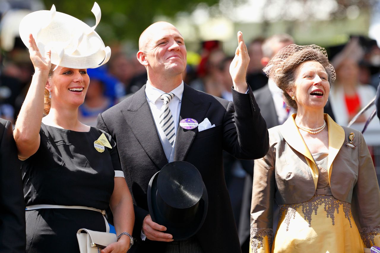Zara Tindall, Mike Tindall and Princess Anne wave to Queen Elizabeth II and other members of the royal family in the carriage procession as they attend Day 1 of Royal Ascot on June 17, 2014Credit: Max Mumby/Indigo/Getty